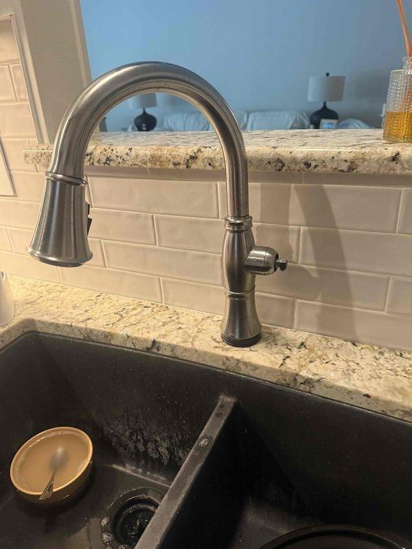 Responded to new customer service call at 40-year-old residential property to address multiple plumbing concerns. Evaluated non-flushing toilet and diagnosed issue preventing proper operation. Inspected kitchen sink faucet handle assembly and assessed functionality of pull-down spray mechanism. Consulted with homeowner regarding specifications for new toilet replacement and provided recommendations for ordering and installation. Tested outdoor hose bib and verified static water pressure reading using gauge. Documented all findings with photographs for service records and coordinated with electrical trade also scheduled onsite for separate bathroom ventilation issue.