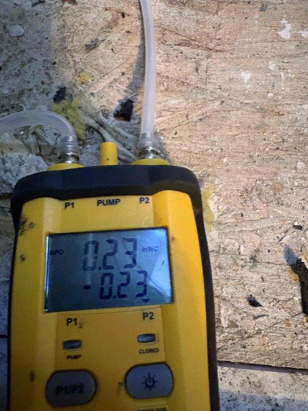 Performed maintenance on a single-zone split system (attic air handler, outdoor condensing unit) as part of a warranty follow-up for a previously diagnosed control/mitigation board failure. Measured static pressure at the air handler with a digital manometer, reading 0.23 in. WC, within acceptable range. Tested the outdoor unit's run capacitor with a true-RMS clamp meter to verify capacitance values were within manufacturer tolerance. System components checked and operating within specification.