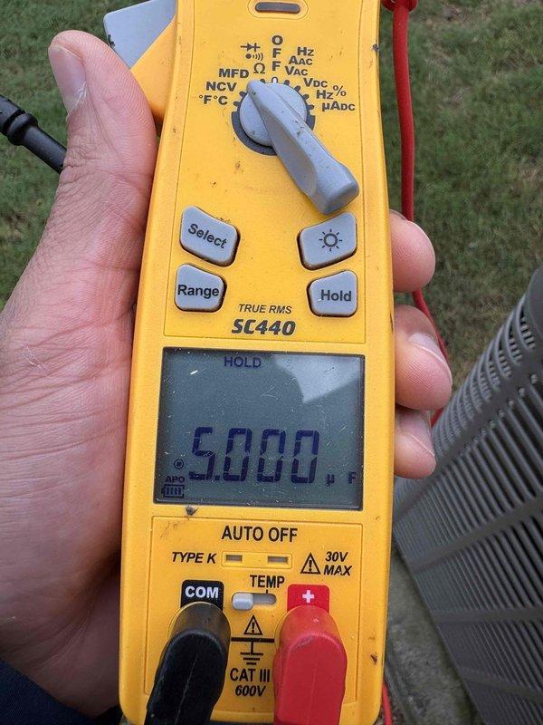 Performed maintenance on a single-zone split system (attic air handler, outdoor condensing unit) as part of a warranty follow-up for a previously diagnosed control/mitigation board failure. Measured static pressure at the air handler with a digital manometer, reading 0.23 in. WC, within acceptable range. Tested the outdoor unit's run capacitor with a true-RMS clamp meter to verify capacitance values were within manufacturer tolerance. System components checked and operating within specification.