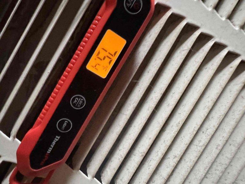 Performed seasonal preventive maintenance on two attic-mounted split systems (2018 and 2021 installs), establishing a baseline performance record for each. Measured supply air temperature at the register with a digital thermometer and verified cooling output, and inspected the attic return and supply plenum, noting foil-faced duct tape intact at the connections. Observed dust and debris accumulation on the return air grille, indicating filtration and cleaning needs. Both systems are operating adequately with no active performance issues reported.