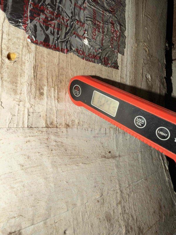 Performed seasonal preventive maintenance on two attic-mounted split systems (2018 and 2021 installs), establishing a baseline performance record for each. Measured supply air temperature at the register with a digital thermometer and verified cooling output, and inspected the attic return and supply plenum, noting foil-faced duct tape intact at the connections. Observed dust and debris accumulation on the return air grille, indicating filtration and cleaning needs. Both systems are operating adequately with no active performance issues reported.
