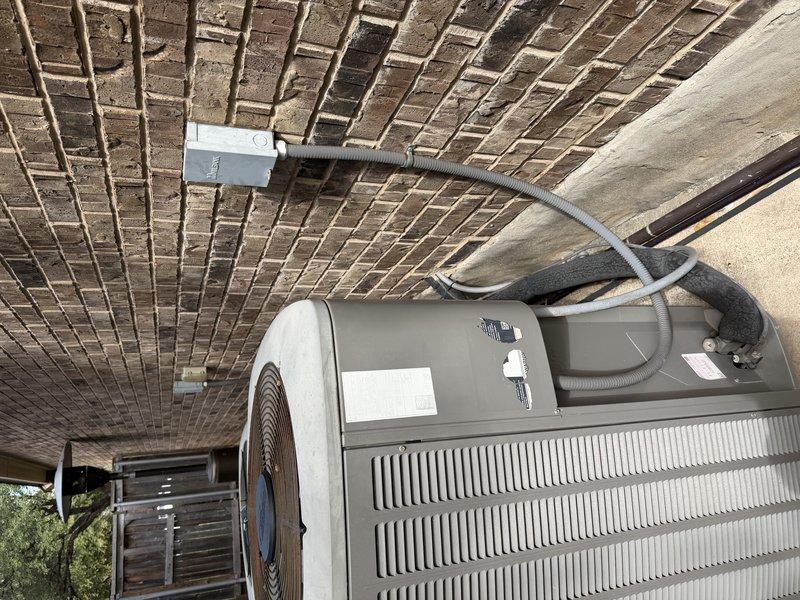Conducted a sales evaluation of two central HVAC split systems installed in 2009, inspecting both outdoor condensing units, electrical disconnect and conduit connections, and refrigerant line sets. Noted weathered, deteriorating foam insulation on the suction line, with no visible frost, rust, or physical damage to the condensers. Based on system age, assessed replacement options for the aging equipment.