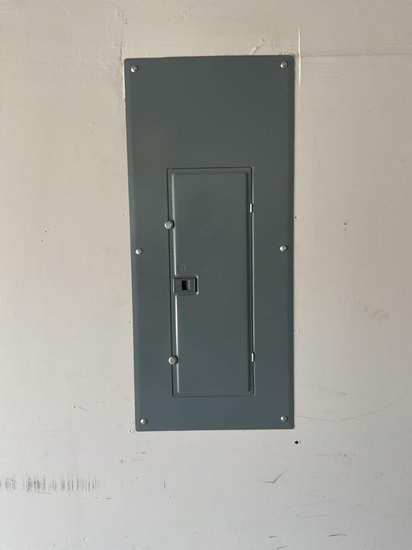 Performed a whole-home electrical maintenance inspection, documenting baseline condition of both service panels: the interior panel cover and the exterior service equipment (meter, service disconnect, and Generac-labeled enclosure). Visual inspection found the exterior equipment and conduit runs free of rust, corrosion, cracks, or physical damage, and the interior panel cover intact and securely fastened with only minor cosmetic wall scuffing, with no deficiencies noted.