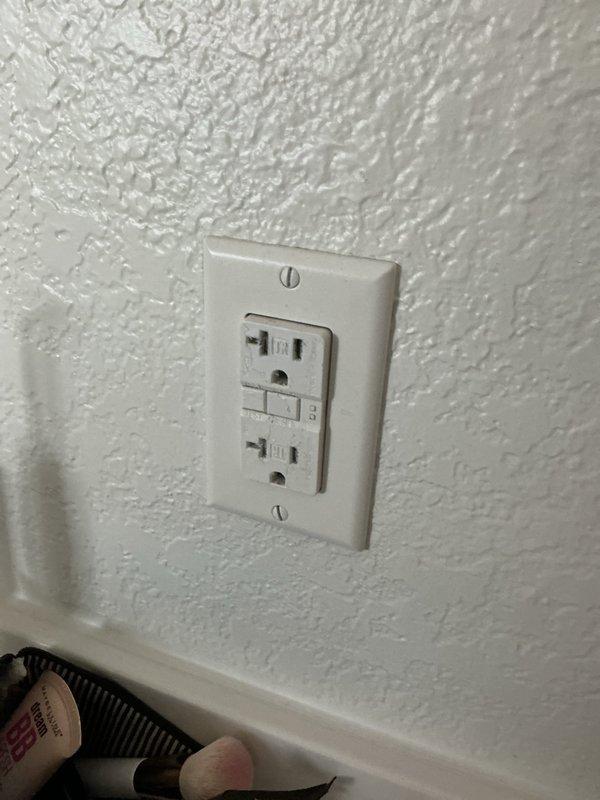 Responded to a reported issue of the garbage disposal switch tripping and then losing function. Inspected the exterior electrical panel, which was found clean and in good condition with no visible rust, corrosion, or damage, and verified the surge protector and breaker configuration. Inspected the GFCI receptacle serving the area, confirming it was properly mounted and free of visible damage.