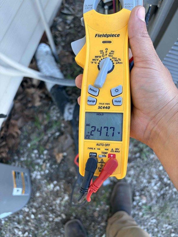 Responded to a no-cooling call on the outdoor condensing unit with a hot suction line. Performed electrical diagnostics at the outdoor unit using a clamp meter, confirming approximately 248 volts AC supply voltage at the disconnect/unit. Inspected the outdoor unit and line set for abnormal operation and documented findings with photos. Reviewed system condition with the owner and discussed repair options.