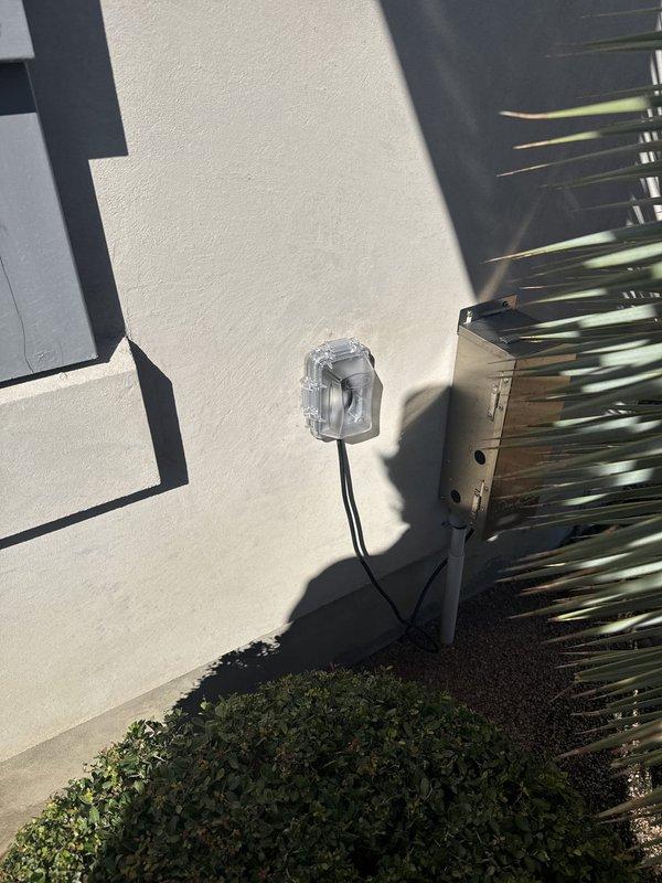 Replaced four exterior weatherproof outlet bubble covers and re-sealed around each outlet with fresh silicone to restore weather protection. Removed the existing above-counter and under-cabinet lighting (six fixtures) and installed ten customer-supplied brown under-cabinet lights per the planned layout, linking fixtures together where possible and neatly securing the wiring along the top of the cabinets near the back wall to keep it concealed.
