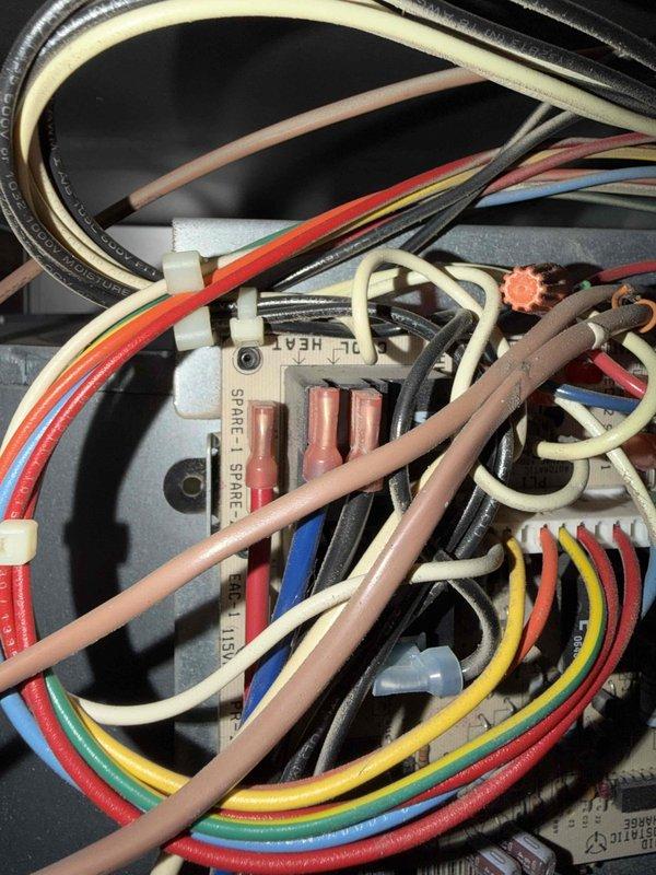 Performed a combination tune-up on a single attic-mounted split system consisting of a 4–5 year old condenser paired with the original air handler and furnace. Inspected the control board and low-voltage wiring, and tested the condenser run capacitor with a true RMS clamp meter, measuring 5.61 µF against its 7.5 µF rating. This indicates a capacitor reading below tolerance that should be monitored or replaced to prevent a future hard-start or compressor failure.