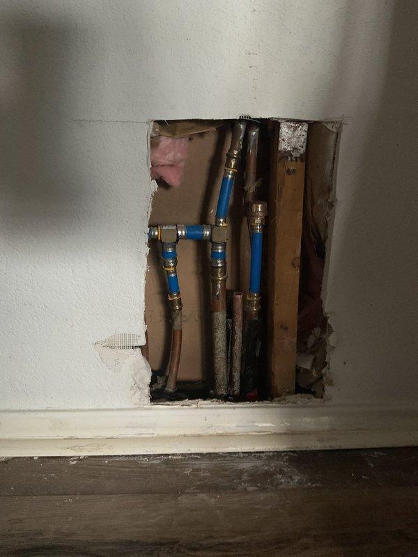 Performed a Level 5 slab leak isolation diagnostic on a suspected hot-side leak, using manifold isolation testing and line tracing to identify the affected hot water line. Accessed the manifold and associated PEX and copper supply lines by cutting an inspection opening in the drywall, and documented the exposed piping with photos. The affected line is now narrowed down for repair recommendations, with no excavation, slab penetration, or repair performed during this diagnostic.