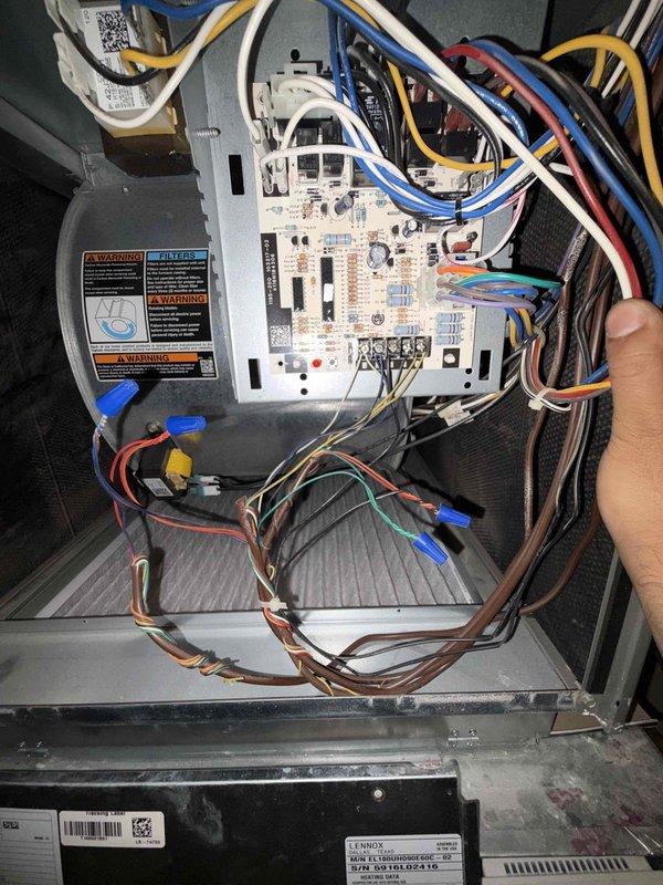 Responded to a no-heat complaint following recent maintenance and inspected the Lennox furnace control board, low-voltage wiring, and blower compartment, including terminal connections, wire nut splices, and wiring harness routing. Also inspected the supply plenum takeoff collar and verified sealant and insulation condition at the damper fitting, then confirmed the unit was operating properly through a heating cycle.