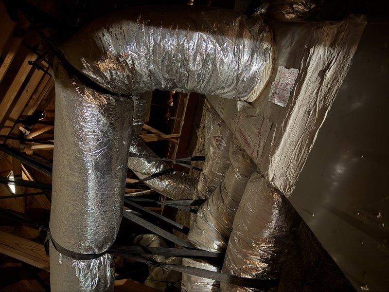 Performed maintenance inspection on a 19-year-old attic-installed furnace and air handler, identifying a leaking blower motor, a motor capacitor out of tolerance, and a dirty flame sensor that remained unserviceable after cleaning. Documented system condition with photos and recommended replacement of the failing components, with the aging equipment flagged as a candidate for system replacement evaluation.