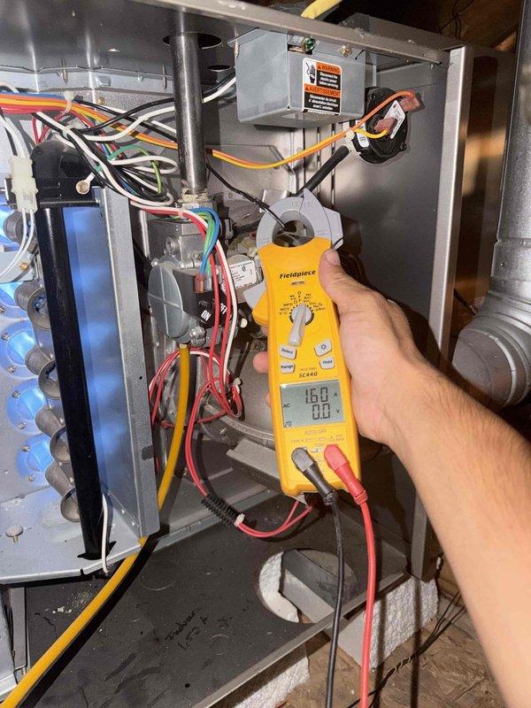 Performed seasonal preventive maintenance on two attic-mounted systems, inspecting major components and verifying operation. Used a true RMS clamp meter to measure amperage draw on the furnace's electrical circuits and motor components, confirming readings were within normal operating range. No faults or abnormal conditions were identified, and both systems were left operating normally.