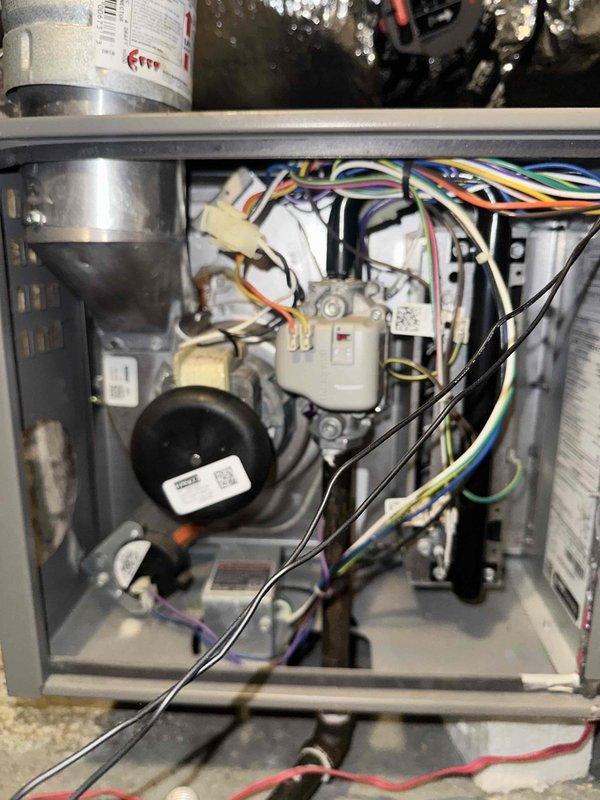Performed a comprehensive maintenance inspection on a 6-year-old gas furnace and split-system condenser. Inspected the furnace cabinet, draft inducer assembly, pressure switch, gas valve, flue connection, and control wiring, and verified all components were intact and in serviceable condition. Examined the outdoor condenser unit, pad, and insulated refrigerant line set; found no signs of frost, rust, or damage, and the system is operating properly with no issues identified.