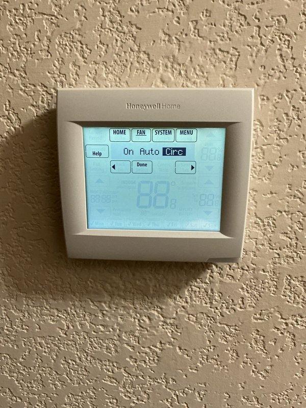 Responded to a recurring thermostat complaint where the indoor temperature was overshooting the setpoint. Inspected the Honeywell Home wall thermostat and observed the system in heat mode with the space reading 78° against a 71° setpoint, confirming heat was running past the call. Accessed the thermostat's menu and diagnostic display to verify settings and screen function (segment check displayed normally, fan set to auto circulation). Documented thermostat operation and overshoot condition for further evaluation of the control and its wiring/calibration.