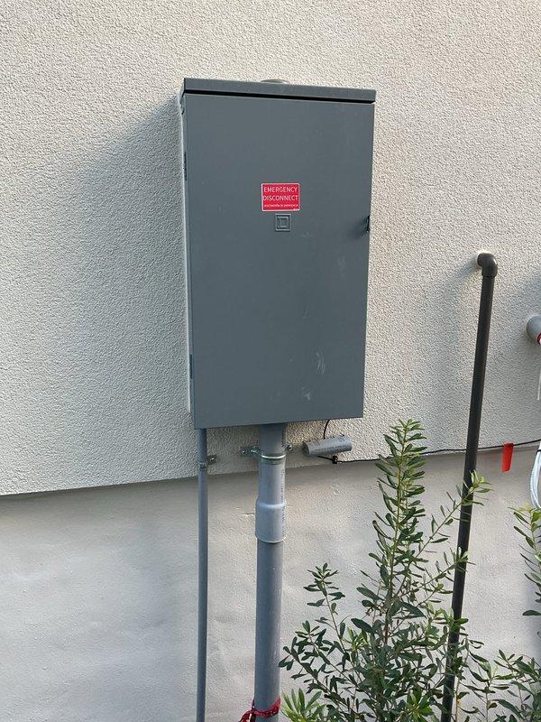 Responded to a report of a possible electrical line strike during drilling and inspected the main service equipment, including the exterior disconnect enclosure, conduit runs, and fittings, along with the affected interior receptacle and surrounding wall area. No visible damage, discoloration, or signs of overheating were found at the outlet or adjacent wall surface, and the exterior enclosure and conduit appeared intact and properly secured.