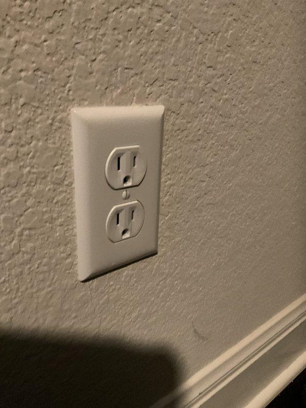 Responded to a report of a possible electrical line strike during drilling and inspected the main service equipment, including the exterior disconnect enclosure, conduit runs, and fittings, along with the affected interior receptacle and surrounding wall area. No visible damage, discoloration, or signs of overheating were found at the outlet or adjacent wall surface, and the exterior enclosure and conduit appeared intact and properly secured.