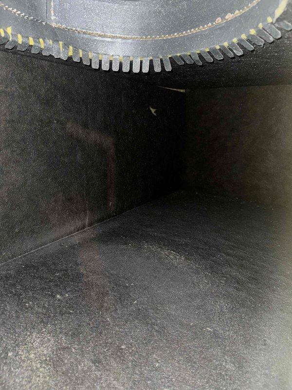 Performed seasonal maintenance on a single-zone attic-mounted system consisting of a new 3-ton, 16 SEER2 two-stage condenser, evaporator coil, and gas furnace. Inspected the internal plenum and duct interior, which showed light dust and debris accumulation on the duct floor, with the collar takeoff fitting sealed and intact. Measured total external static pressure with a dual-port manometer at approximately 1.45 inWC, indicating elevated airflow resistance. Recommend evaluating duct sizing, filtration, and return airflow capacity to restore airflow within manufacturer specifications and protect long-term system performance.