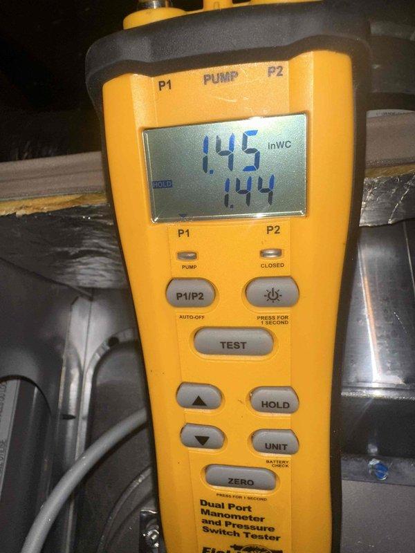 Performed seasonal maintenance on a single-zone attic-mounted system consisting of a new 3-ton, 16 SEER2 two-stage condenser, evaporator coil, and gas furnace. Inspected the internal plenum and duct interior, which showed light dust and debris accumulation on the duct floor, with the collar takeoff fitting sealed and intact. Measured total external static pressure with a dual-port manometer at approximately 1.45 inWC, indicating elevated airflow resistance. Recommend evaluating duct sizing, filtration, and return airflow capacity to restore airflow within manufacturer specifications and protect long-term system performance.