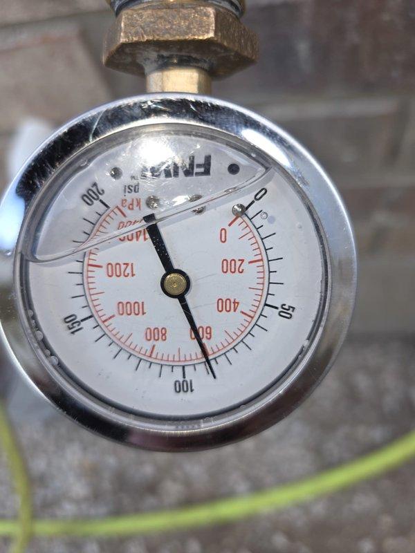 Performed a flush and sediment removal on the electric tank-style water heater. During the visit, a static water pressure test at the hose bib recorded approximately 90 psi, well above the recommended 80 psi maximum, indicating the pressure-reducing valve has failed. Documented the findings and advised that excessive pressure can cause leaks, damage fixtures and appliances, and void manufacturer warranties, and recommended installing a new pressure-reducing valve and a thermal expansion tank to protect the plumbing system.