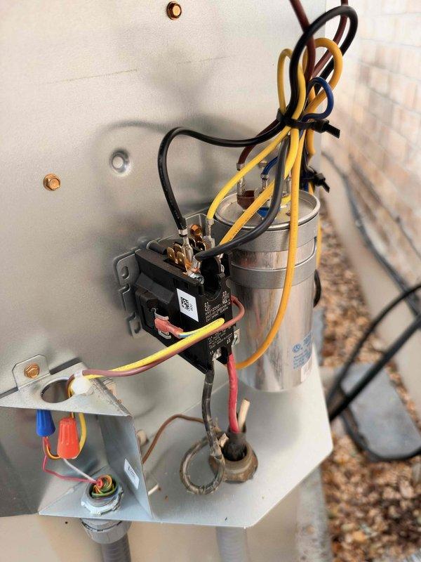 Performed a member maintenance inspection on the residential split system, evaluating the Lennox furnace control module and the outdoor condenser's electrical compartment. Found loose, unsecured low-voltage and line-voltage wiring at the furnace control module and transformer, and observed worn, frayed wire insulation near the grommet at the condenser's electrical compartment, with the contactor and capacitor otherwise intact and no frost, rust, or visible damage. Documented conditions for follow-up, with wire management and insulation repair recommended; condenser age was previously noted as original, and replacement options remain open.