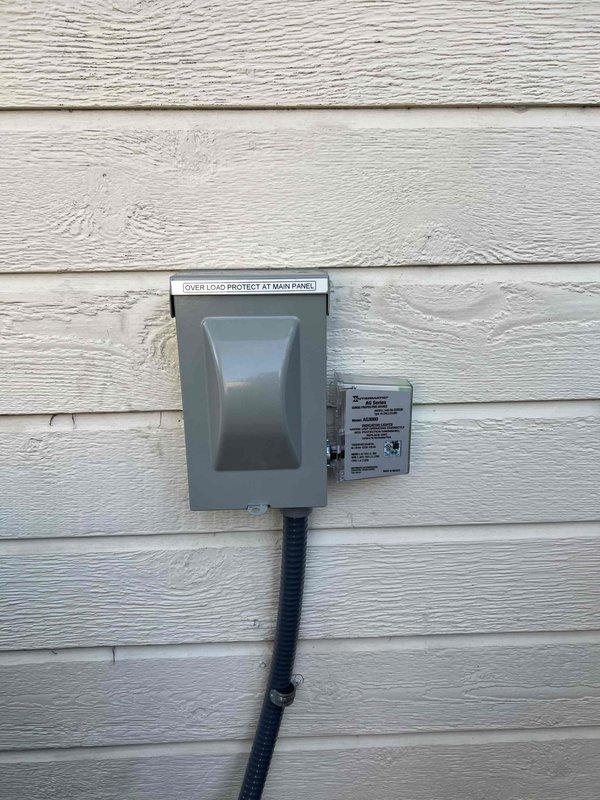 Returned to site to correct a failed inspection item by labeling the AC circuit breaker at the main electrical panel, ensuring the breaker is clearly identified as "AC" for the condensing unit circuit. Verified the exterior AC disconnect and surge protection device are securely mounted, properly labeled with "OVER LOAD PROTECT AT MAIN PANEL," and the flexible conduit is clamped and routed correctly.