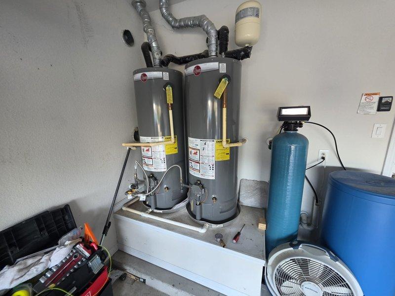 Performed a flush on two gas tank-style water heaters, draining and removing sediment from each tank to restore efficiency and extend service life. Inspected both units, including flue/draft hood venting, insulated supply lines, gas connections, and the expansion tank, and found no visible leaks, rust, or damage, with the system left in proper working order.