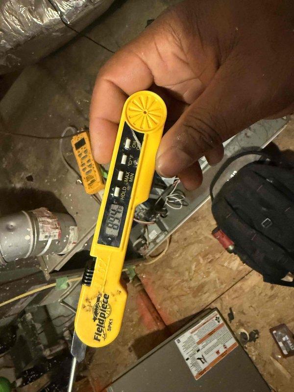 Performed seasonal preventative maintenance on a single attic-mounted HVAC system, accessing the unit and inspecting the air handler, ductwork, and flue/vent piping. Used handheld diagnostic instruments to take system measurements and evaluate performance, and observed the reflective-wrapped flexible duct runs and metal vent pipe for condition and integrity. Previously identified issues, including conditioned air leakage into the attic, remain on record for follow-up.