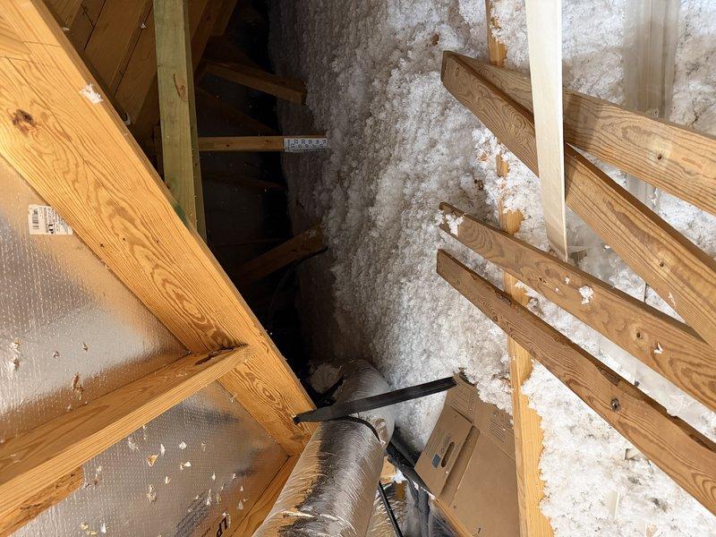 Performed an on-site evaluation for a ductless mini-split addition to a detached-use garage, including inspection of the existing attic-mounted central system and framing to assess installation routing and electrical requirements. Completed a Manual J load calculation for the 672 sq ft garage (framed R13 walls, vented attic with R30 ceiling insulation, slab-on-grade, 10 ft ceiling height, semi-loose infiltration), yielding a 16,813 Btuh heating load and 10,523 Btuh sensible/1,847 Btuh latent cooling load (approximately 1.3 tons), and prepared a right-sized single-zone mini-split system proposal with a dedicated electrical circuit run.