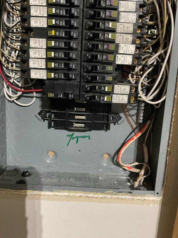 Performed an electrical member maintenance inspection of the main breaker panel, visually assessing the Square D breakers, bus stabs, conductor routing, and neutral/ground bus terminations. Observed multiple unused bus stab positions with exposed contacts, along with dust and grime buildup inside the enclosure. Documented panel interior condition with photographs for the service record.