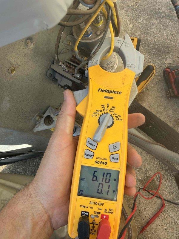 Performed A/C cooling maintenance on two 2020 split systems, with attic air handlers and outdoor condensing units serviced ahead of a home inspection. Electrical testing at the outdoor unit included capacitor microfarad measurement (33.33 µF reading) and condenser amp draw verification (6.10 A on the monitored circuit), and the contactor, wiring, and connections were inspected with no visible damage, rust, or debris concerns noted.