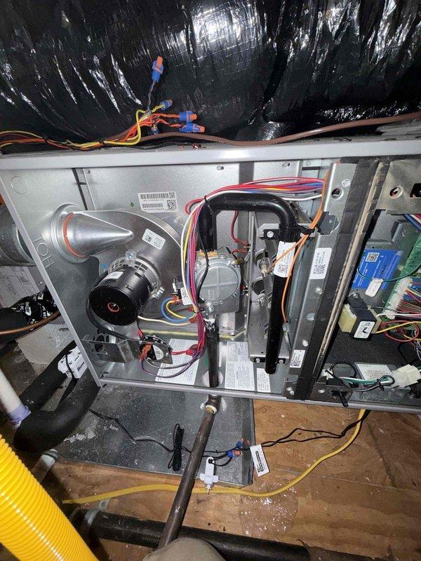 Performed seasonal maintenance on two attic-mounted gas furnace systems. Inspected and cleaned the flame sensor, and verified gas valve, draft inducer assembly, condensate drain line, wiring connections, and control board were in proper working condition. Both systems operated normally with no deficiencies found.