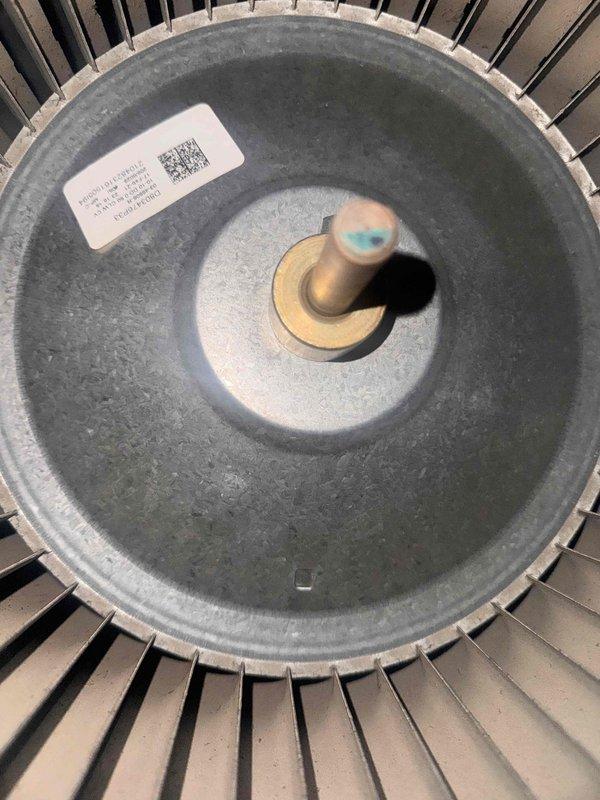 Responded to a no-cooling call with multiple fault codes and inspected the air handler, finding visible microbial growth/staining on the internal fiberglass duct board lining of the plenum and a dust- and debris-laden blower wheel restricting airflow. Documented the contamination of the plenum lining and blower assembly with photos, and the unit's condition should be addressed through cleaning or replacement of the affected components to restore proper airflow and cooling performance.