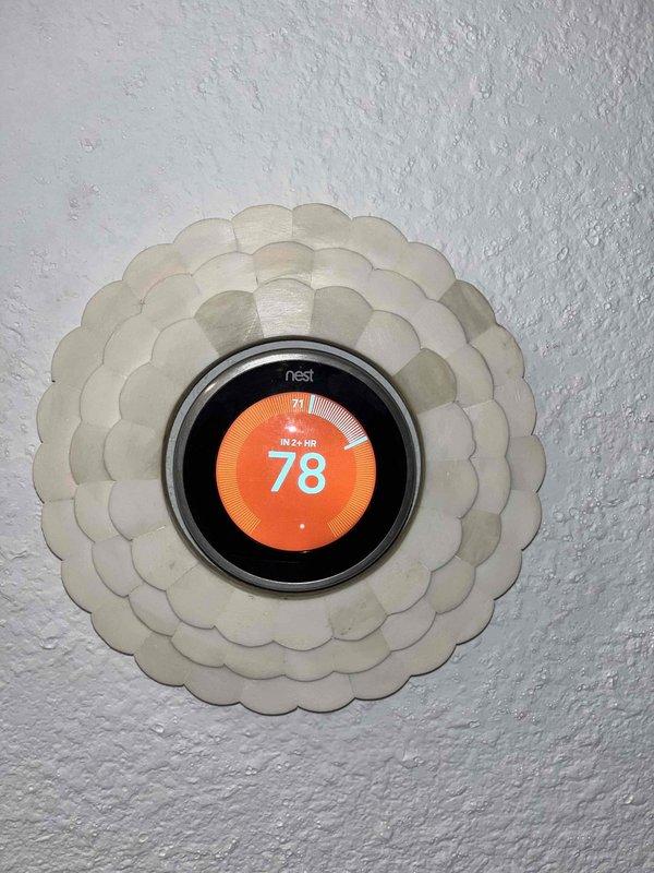 Performed a member maintenance visit on a single 5-year-old residential HVAC system located in a closet. Inspected the equipment compartment and control wiring, and measured operating amperage with a true RMS clamp meter, recording 18.64 A on the monitored conductor to verify the system was drawing current within normal operating range. Verified thermostat operation on the wall-mounted Nest unit, confirming the display, setpoint, and temperature readings were functioning properly.
