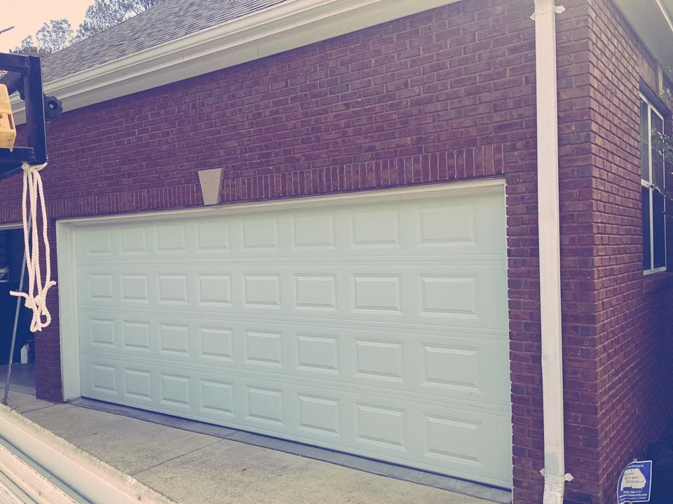 Troy, AL - New 18x8 CHI steel back insulated door. 