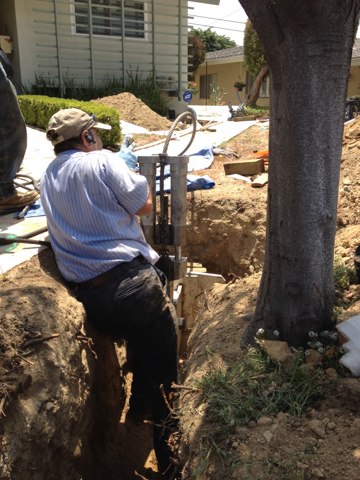 Pipe bursting method for sewer replacement in progress