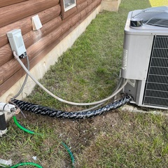 Maintenance on a Carrier ac system. Removed old insulation wrap on copper pipes and rewrapped pipes with new insulation and with uv resistant tape. 