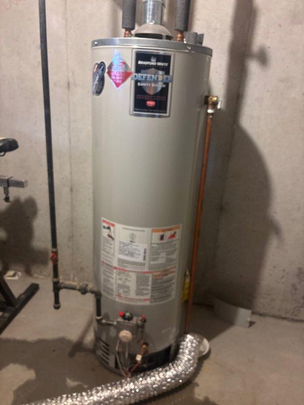 Conducted no-charge estimate for replacement of existing Bradford White Defender 40-gallon water heater located in basement. Unit appears functional but customer seeking replacement options. Documented current installation configuration including copper supply lines and metal exhaust venting for accurate quote preparation.