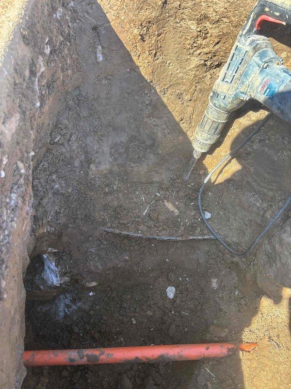 Excavated access to main water line to address significantly reduced water pressure that occurred following fiber optic installation in the neighborhood. Hand-digging was necessary due to numerous underground utilities and pipes in the repair area. Successfully repaired the compromised water main, restored full water pressure throughout the residence, and backfilled the excavation site.