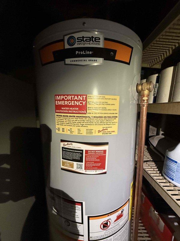 Successfully installed a 40-gallon State ProLine Commercial Grade gas water heater with thermal expansion tank in utility area. Completed all necessary copper pipe connections with soldered joints and installed appropriate valves. Installation included proper venting and connection to existing gas line per manufacturer specifications.