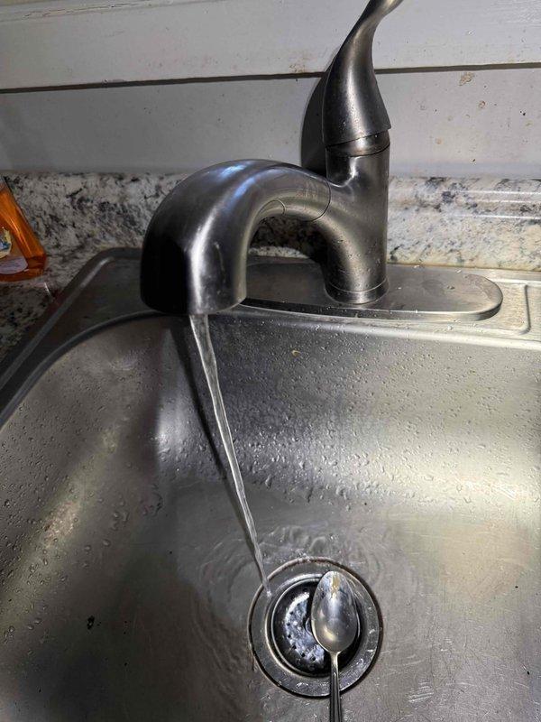 Responded to service call regarding deteriorated wax ring on toilet causing floor seepage. Upon inspection, confirmed failure of wax seal at toilet base with visible water damage and discoloration at fixture-floor junction. Removed toilet, replaced wax ring with new seal, and reinstalled fixture with proper alignment to prevent future leakage.