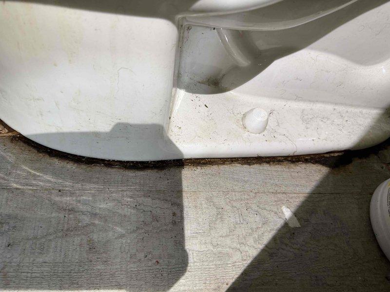 Responded to service call regarding deteriorated wax ring on toilet causing floor seepage. Upon inspection, confirmed failure of wax seal at toilet base with visible water damage and discoloration at fixture-floor junction. Removed toilet, replaced wax ring with new seal, and reinstalled fixture with proper alignment to prevent future leakage.