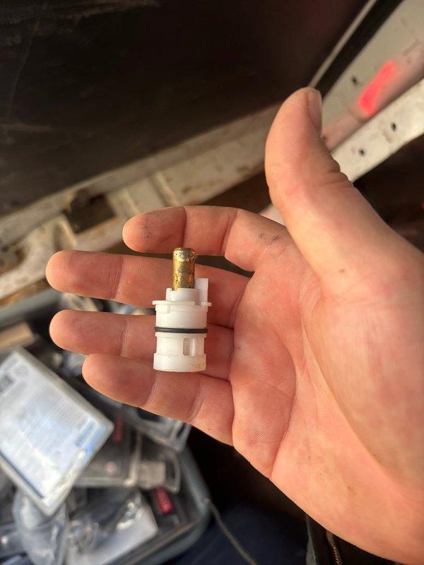Responded to service call for kitchen faucet hot water leak and bathroom sink shut-off valve leak. Diagnosed and replaced faulty valve stem component that was showing significant wear and discoloration. Successfully restored proper function to both the kitchen faucet system and bathroom plumbing fixture, eliminating all leaks.