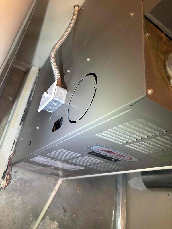 Conducted comprehensive plumbing system maintenance inspection with focus on Bradford White water heater system and associated components. Examined tank, expansion tank, ventilation duct, copper pipes, brass fittings, and PEX piping, confirming all connections are secure with no signs of leaks, corrosion, or damage. Also inspected adjacent HVAC unit with electrical connections and ventilation components, all systems functioning properly with no issues identified.