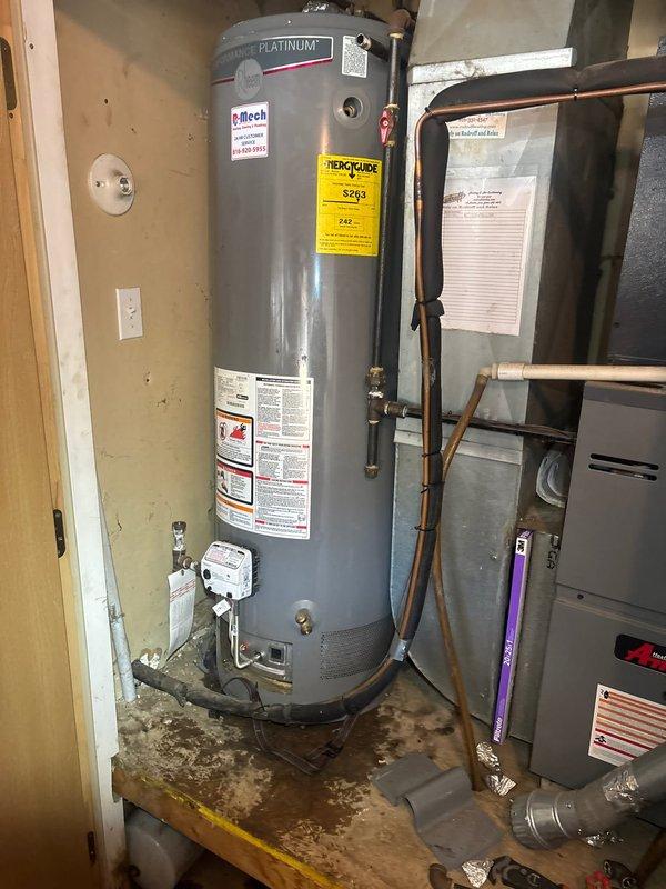 Successfully installed a new 40-gallon Rheem Platinum gas water heater with thermal expansion tank in utility room. Completed all necessary copper pipe connections, installed proper gas line connection, and verified system operation. Equipment was properly mounted and all safety features were confirmed functional.