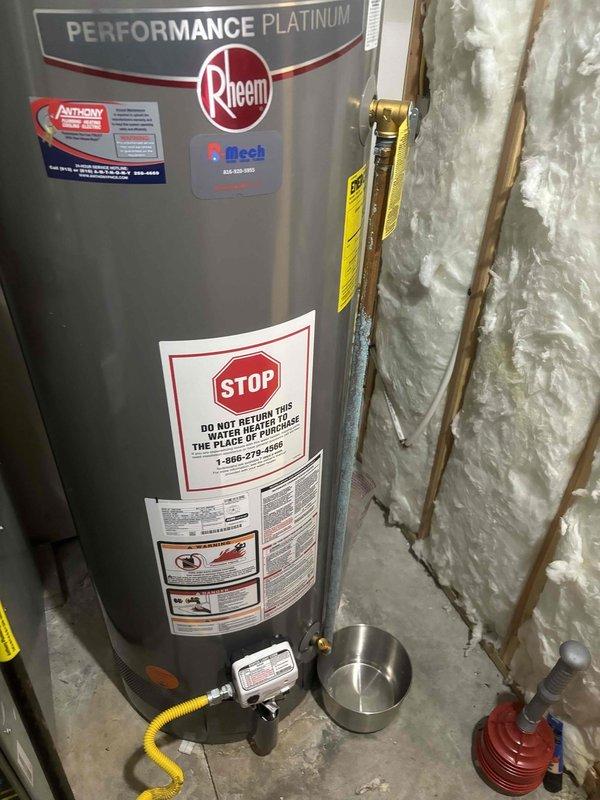 Inspected water heater pressure relief valve leakage issue on Rheem Performance Platinum unit installed in 2022. Found system pressure reading approximately 130-140 psi (well above normal range), with visible corrosion on copper piping. Replaced defective pressure relief valve and adjusted water pressure to manufacturer specifications to resolve the leak.