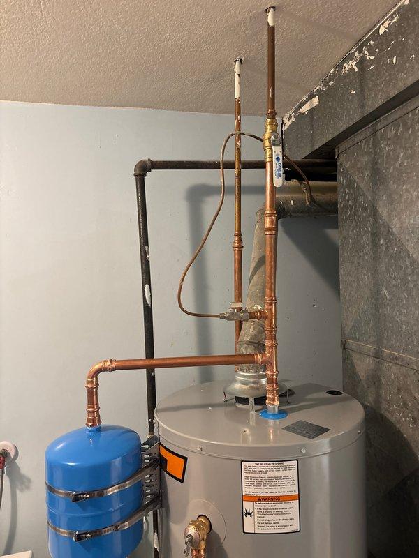 Successfully installed a 40-gallon State gas water heater with a 6-year manufacturer warranty and 1-year parts/labor warranty. Completed installation of a thermal expansion tank with proper metal strapping for security. Installed two 5/8"x1/4" quarter-turn stops on the cold water side with all necessary copper piping connections.