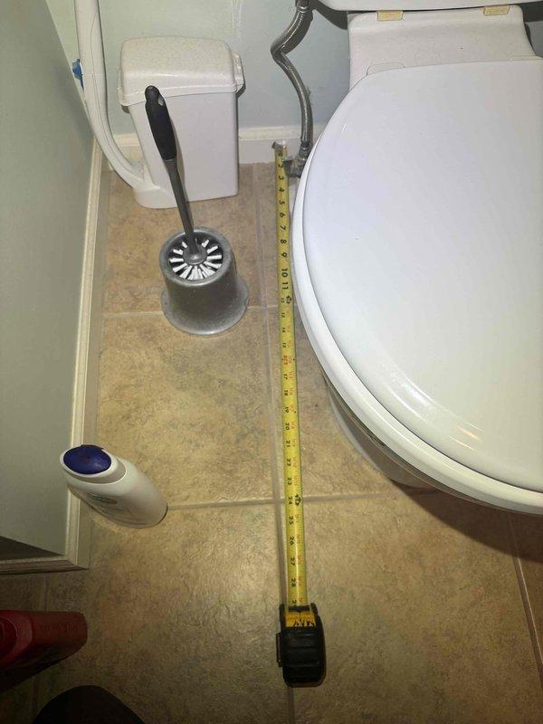 Responded to service call for toilet leaking at base in primary bathroom. Inspected water supply line connection and valve assembly, noting minor corrosion. Measured toilet positioning, replaced worn wax ring seal and tightened mounting bolts to resolve leak at base.