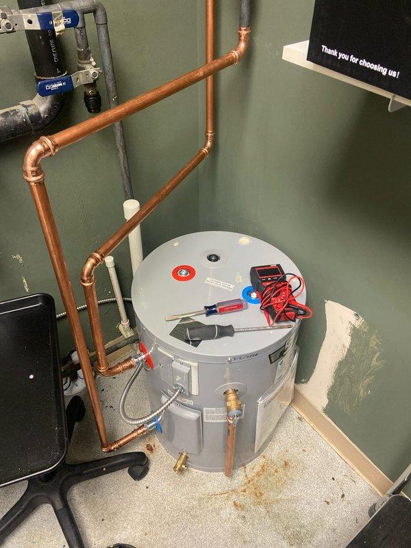 Successfully installed a new 20-gallon electric water heater in the utility room, including proper connection of copper supply lines and PVC drainage components. All connections were pressure tested, electrical connections verified with multimeter, and the system was confirmed operational with no leaks at shutoff valves or pipe joints.