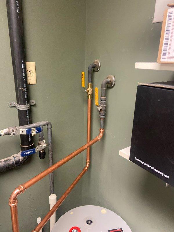 Successfully installed a new 20-gallon electric water heater in the utility room, including proper connection of copper supply lines and PVC drainage components. All connections were pressure tested, electrical connections verified with multimeter, and the system was confirmed operational with no leaks at shutoff valves or pipe joints.