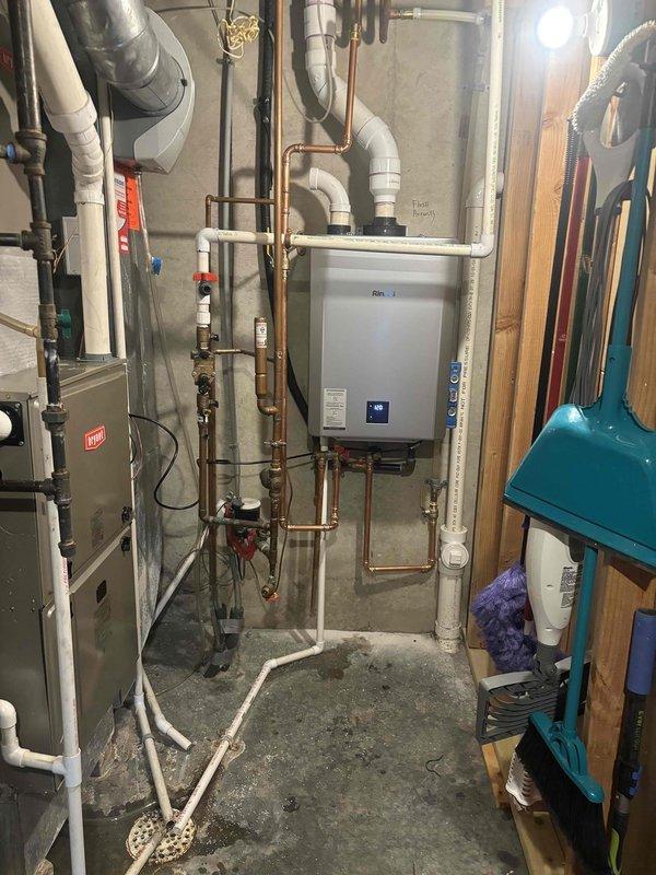 Successfully completed installation of a Rinnai RXP199in tankless water heater, replacing previous unit. Work included proper mounting of the new unit to wall, installation of copper supply lines with appropriate valves, and connection to existing PVC venting system. All connections were tested and system was verified to be functioning correctly before completion.