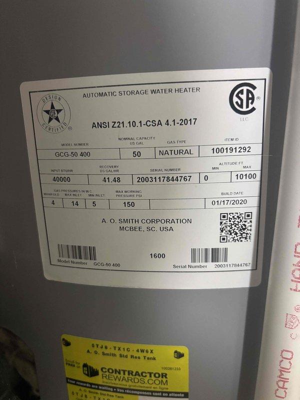Conducted assessment of customer's 6-year-old tankless water heater located in basement. Upon inspection, identified an A.O. Smith GCG-50 400 model with 50-gallon capacity and 40,000 BTU input (manufactured 01/17/2020). System is currently operational but customer is considering replacement options for their existing unit.